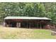 View of barn showing wood storage at 3129 Etchison Rd, Loganville, GA 30052