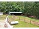 View from deck of the large barn and fenced pastures at 3129 Etchison Rd, Loganville, GA 30052