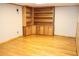 Spacious basement area with bamboo flooring and custom built-in shelves and storage cabinets at 3129 Etchison Rd, Loganville, GA 30052