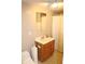 Modest bathroom with a wood vanity cabinet and faucet and a shower behind a curtain at 3129 Etchison Rd, Loganville, GA 30052