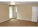 Bedroom featuring neutral carpeting, a closet, and a bright window for natural light at 3129 Etchison Rd, Loganville, GA 30052