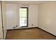 Bedroom featuring carpet, and a window with views of the balcony at 3129 Etchison Rd, Loganville, GA 30052