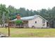 Side view of a single-story home with a cozy covered porch at 3129 Etchison Rd, Loganville, GA 30052