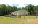 The home shows fenced yard and large propane tank at 3129 Etchison Rd, Loganville, GA 30052