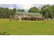 Exterior view showcasing the home's back with two-story deck and large open yard at 3129 Etchison Rd, Loganville, GA 30052