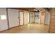 Spacious garage featuring white walls, window, door, and a hutch in the background at 3129 Etchison Rd, Loganville, GA 30052