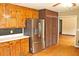 Kitchen showcasing stainless refrigerator and convenient pantry closet at 3129 Etchison Rd, Loganville, GA 30052