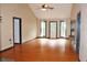 Spacious living room with hardwood floors, neutral walls, and ample natural light at 3129 Etchison Rd, Loganville, GA 30052