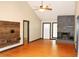 Living room featuring fireplace, hardwood floors, and abundant natural light at 3129 Etchison Rd, Loganville, GA 30052