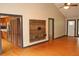 Bright, open-concept living area with hardwood floors, vaulted ceiling, and modern built-in media center at 3129 Etchison Rd, Loganville, GA 30052