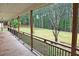 View from the porch, featuring wood flooring and backyard views at 3129 Etchison Rd, Loganville, GA 30052