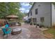 Spacious backyard featuring a large patio with a hot tub, fire pit, and gazebo at 3202 Ivy Station Way, Duluth, GA 30096