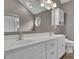 Bathroom featuring dual sinks with modern faucets and a skylight at 3202 Ivy Station Way, Duluth, GA 30096