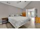 Bright bedroom with vaulted ceiling, natural light, hardwood floors, and wooden dresser at 3202 Ivy Station Way, Duluth, GA 30096