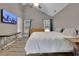 Spacious bedroom with vaulted ceiling, TV, and view of natural light from the windows at 3202 Ivy Station Way, Duluth, GA 30096