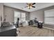 Comfortable bedroom with two windows, grey walls, and hardwood flooring at 3202 Ivy Station Way, Duluth, GA 30096