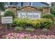 Stone community sign for Ivy Station with colorful landscaping and plantings at 3202 Ivy Station Way, Duluth, GA 30096