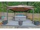 Gazebo featuring a hot tub with privacy curtains at 3202 Ivy Station Way, Duluth, GA 30096
