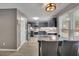 Stylish kitchen with dark cabinets, stainless steel appliances, and breakfast bar at 3202 Ivy Station Way, Duluth, GA 30096