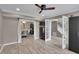 Open floor plan featuring hardwood floors, access to stairway, dining area, and living room at 3202 Ivy Station Way, Duluth, GA 30096