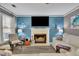 Bright living room with a fireplace, TV, and comfortable white sectional sofa at 3202 Ivy Station Way, Duluth, GA 30096
