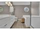 Bright bathroom with a stand alone tub, glass enclosed shower, and dual sinks at 3202 Ivy Station Way, Duluth, GA 30096