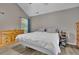 Well lit main bedroom with a large window and wood-look flooring at 3202 Ivy Station Way, Duluth, GA 30096