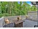 Charming back deck with a table and chairs, perfect for enjoying the serene backyard views at 4492 Riverwood Cir, Decatur, GA 30035