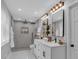 Bright bathroom with dual sinks, sleek mirrors, and a modern shower, blending style with comfort at 4492 Riverwood Cir, Decatur, GA 30035