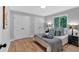 Bedroom with natural light, hardwood floors, and a view to the yard at 4492 Riverwood Cir, Decatur, GA 30035