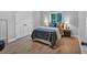 Sunlit bedroom with hardwood floors, and a window view at 4492 Riverwood Cir, Decatur, GA 30035