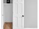 Open closet with shelving and hardwood floors at 4492 Riverwood Cir, Decatur, GA 30035