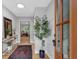 Elegant entryway with sleek console table, decorative mirror, and a view into the sunlit living room at 4492 Riverwood Cir, Decatur, GA 30035