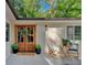 Welcoming entryway featuring a double door, a charming welcome mat, and inviting outdoor seating at 4492 Riverwood Cir, Decatur, GA 30035