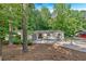 Charming home with a well-manicured lawn, large trees, and a neutral color scheme at 4492 Riverwood Cir, Decatur, GA 30035