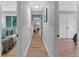 Hallway connecting bedrooms with hardwood floors and white paneled walls at 4492 Riverwood Cir, Decatur, GA 30035