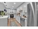 Modern kitchen featuring stainless steel appliances, white cabinets, and elegant countertops at 4492 Riverwood Cir, Decatur, GA 30035