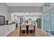 Bright kitchen with white cabinets, stainless steel appliances, breakfast bar and hardwood floors at 4492 Riverwood Cir, Decatur, GA 30035