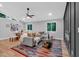 Open living and dining space with hardwood floors, fireplace, and modern furnishings at 4492 Riverwood Cir, Decatur, GA 30035