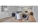 Bright living room with a charming fireplace, hardwood floors, and access to the rear yard at 4492 Riverwood Cir, Decatur, GA 30035