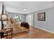 Cozy bedroom features hardwood floors and a comfortable bed complemented by stylish lamps and decor accents at 4492 Riverwood Cir, Decatur, GA 30035