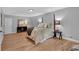 Bedroom features hardwood floors, a bed with decorative pillars, and coordinating furniture for a relaxing retreat at 4492 Riverwood Cir, Decatur, GA 30035