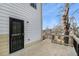 Back porch with wood floors, stairs down to the yard, and black metal railings at 55 Bowen Ave, Atlanta, GA 30315
