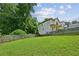 Spacious backyard with a wooden fence and lush green grass, perfect for outdoor activities at 55 Bowen Ave, Atlanta, GA 30315