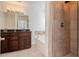 Bathroom featuring double vanity, soaking tub, and tiled shower stall at 55 Bowen Ave, Atlanta, GA 30315
