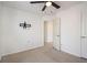 Carpeted bedroom features a ceiling fan, access to a bathroom, and a TV mount at 55 Bowen Ave, Atlanta, GA 30315