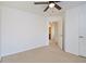 Bedroom with neutral carpet, ceiling fan, white walls, and a doorway to another room at 55 Bowen Ave, Atlanta, GA 30315
