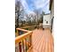 Spacious wooden deck with dark metal railings, perfect for outdoor entertaining and enjoying the surrounding scenery at 55 Bowen Ave, Atlanta, GA 30315