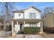 Charming two-story home with a welcoming front porch and well-maintained landscaping at 55 Bowen Ave, Atlanta, GA 30315