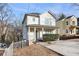 Inviting two-story home with a cozy front porch, nestled in a serene neighborhood setting at 55 Bowen Ave, Atlanta, GA 30315
